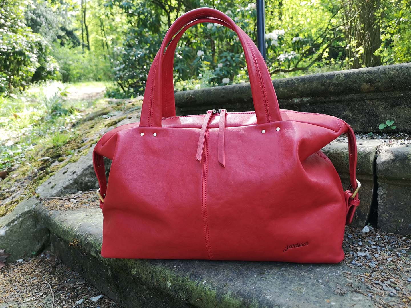Handtaschen als Henkeltasche aus rotem leder